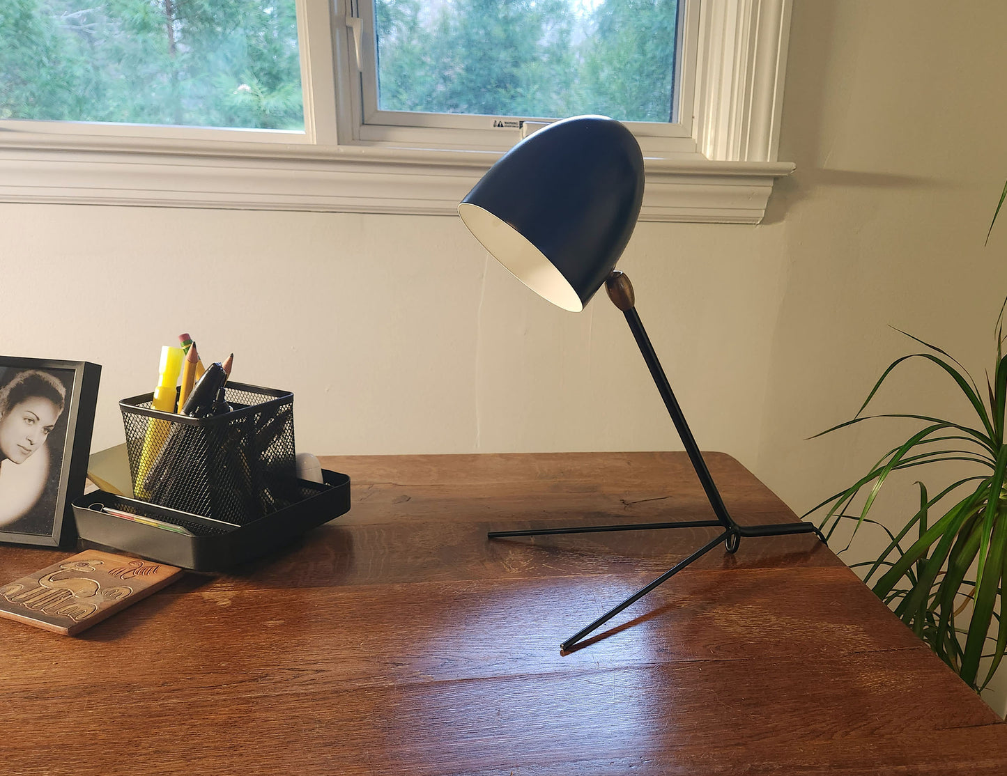 Black Serge Mouille Cocotte Desk Lamp on a desk