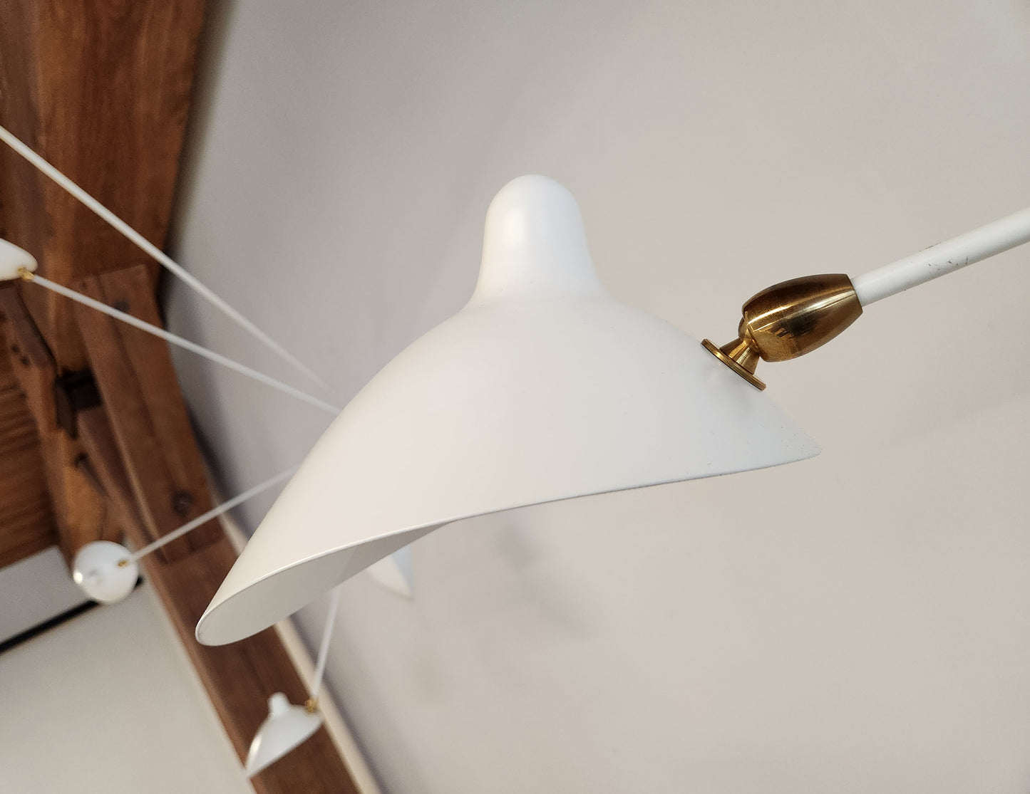 Serge Mouille White Spider Sconce - close up view of shade and brass connector