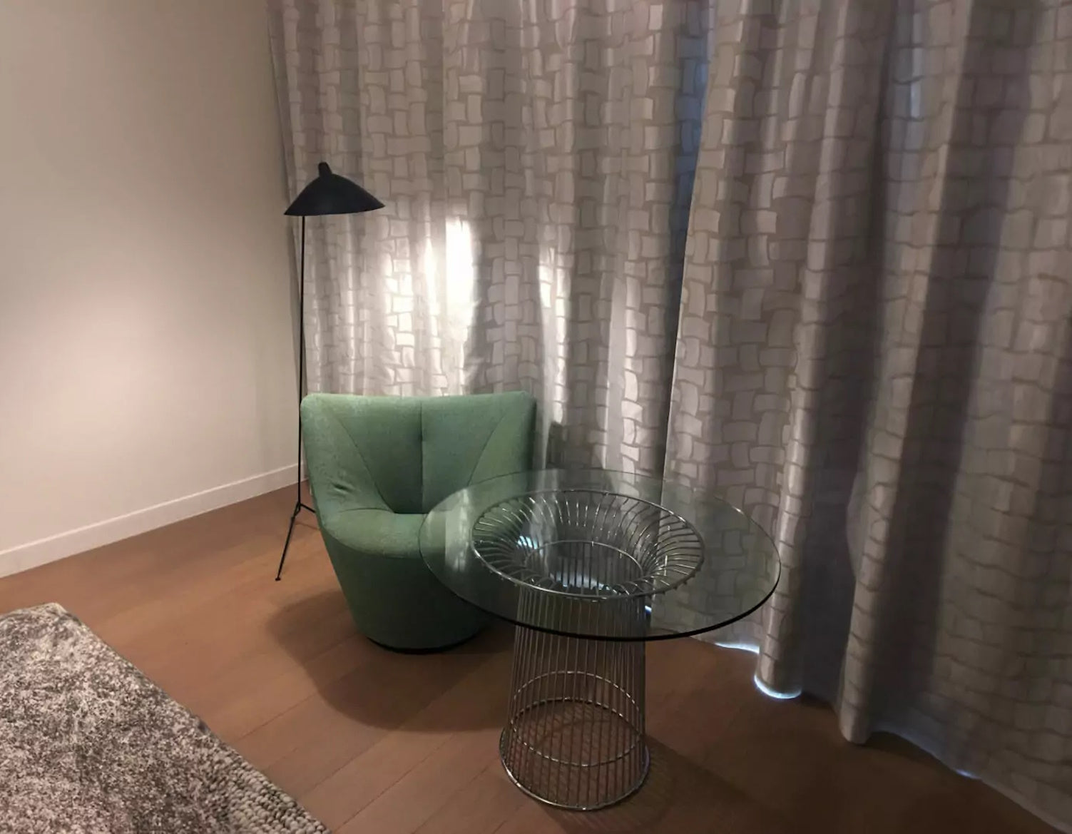 Black Serge Mouille Floor Lamp with 1 Arm in the corner of a room