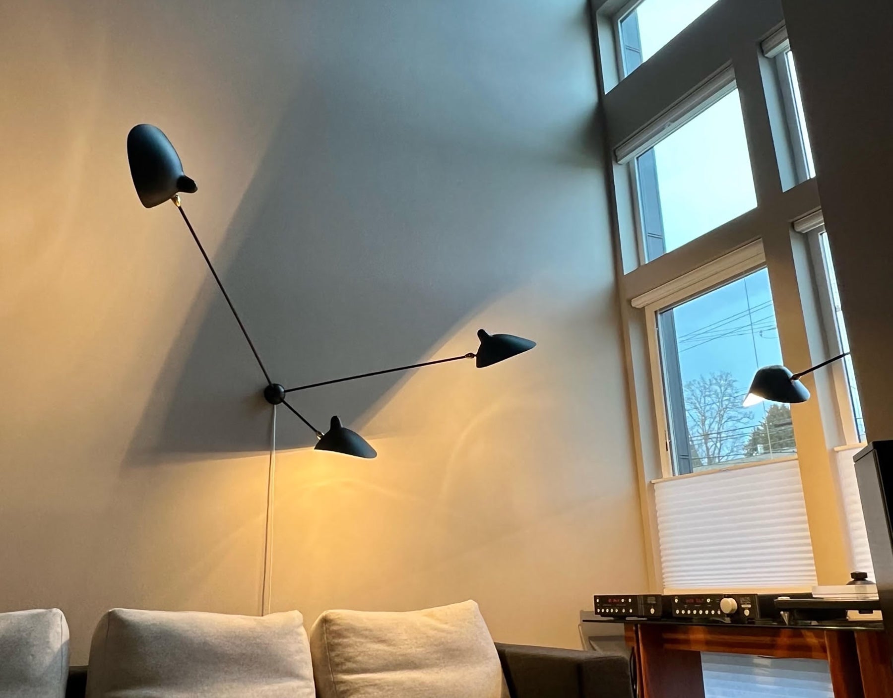 Black Serge Mouille Spider Sconce with 3 Arms at an apartment